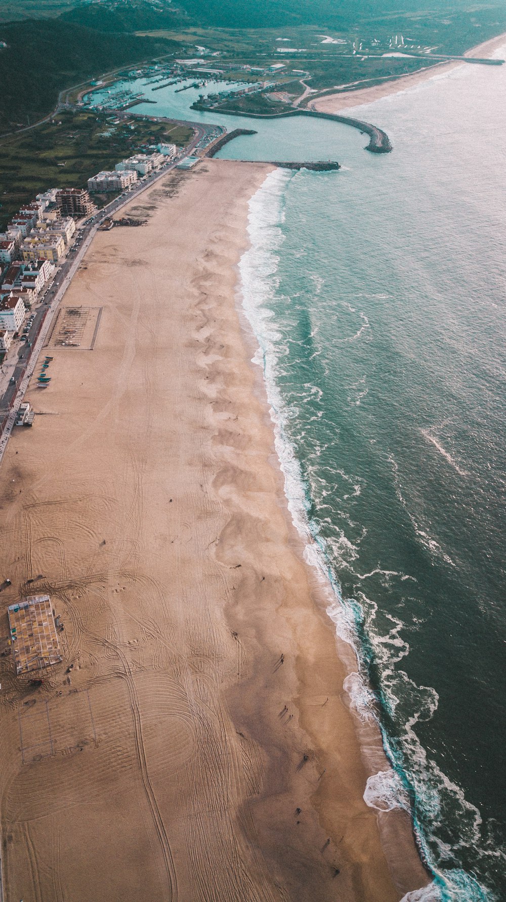 an aerial view of a beach and a body of water