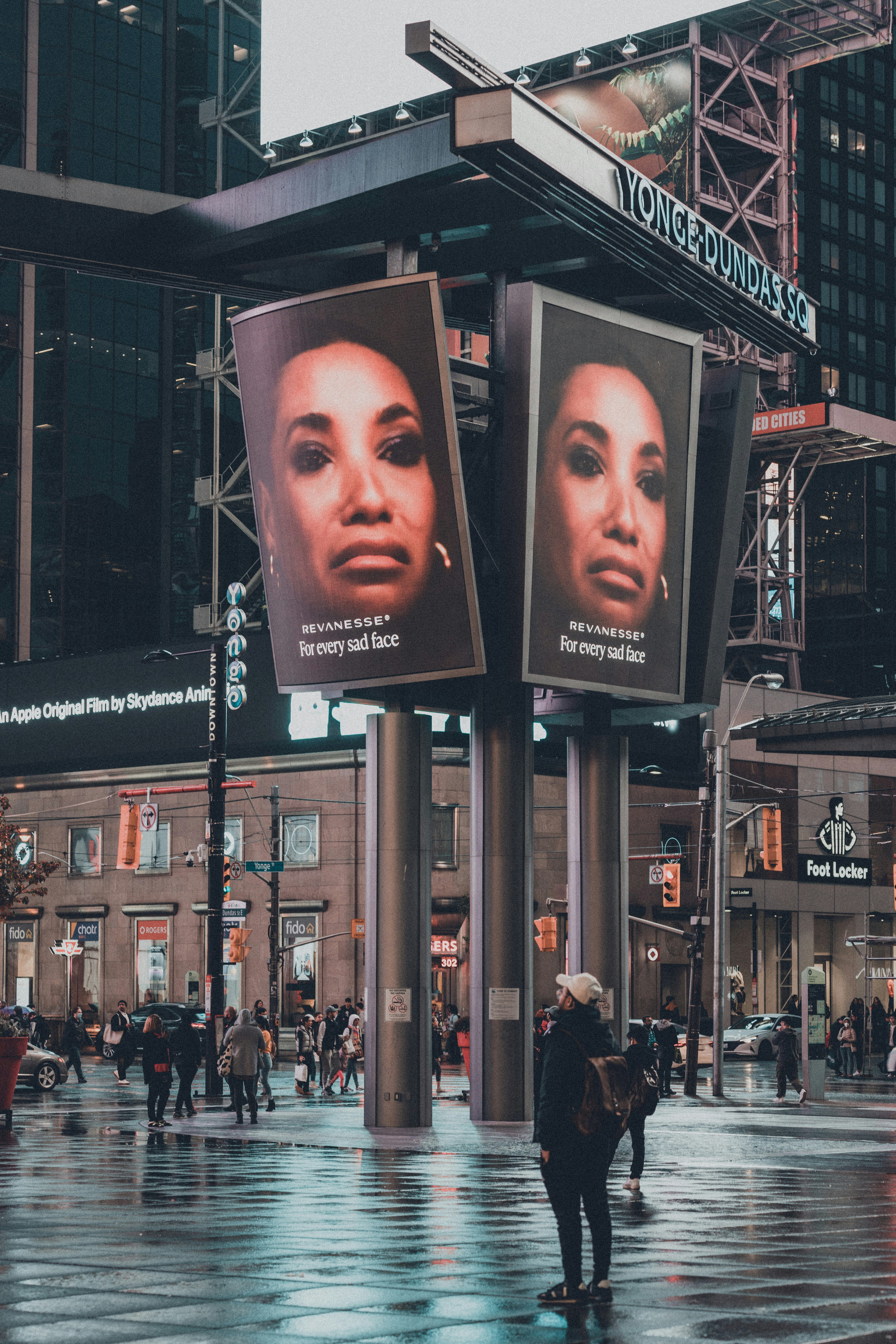 a couple of billboards on a city street