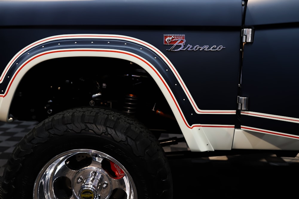 a close up of a truck tire on a checkered floor