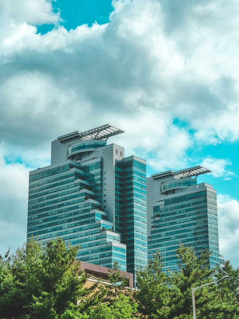 a very tall building sitting next to some trees