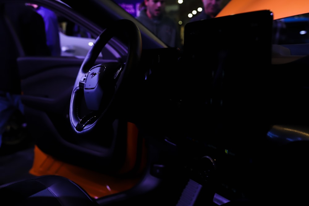 a close up of a steering wheel of a car