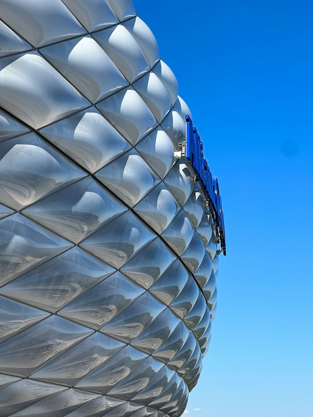 a large metal structure with a sky background