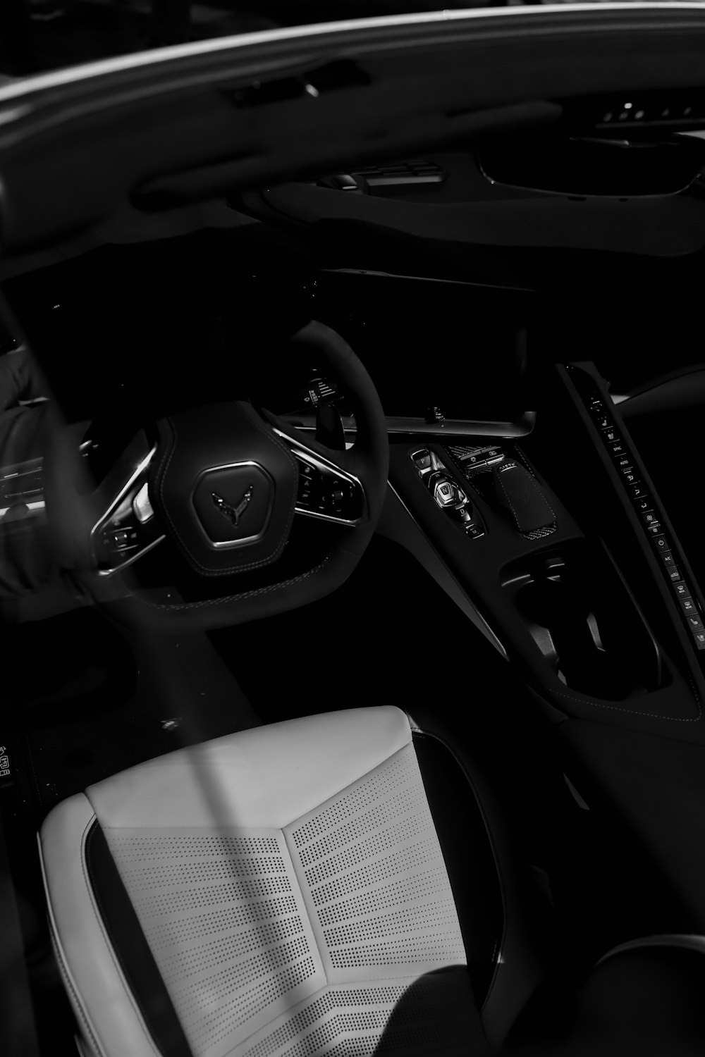 a black and white photo of a car interior