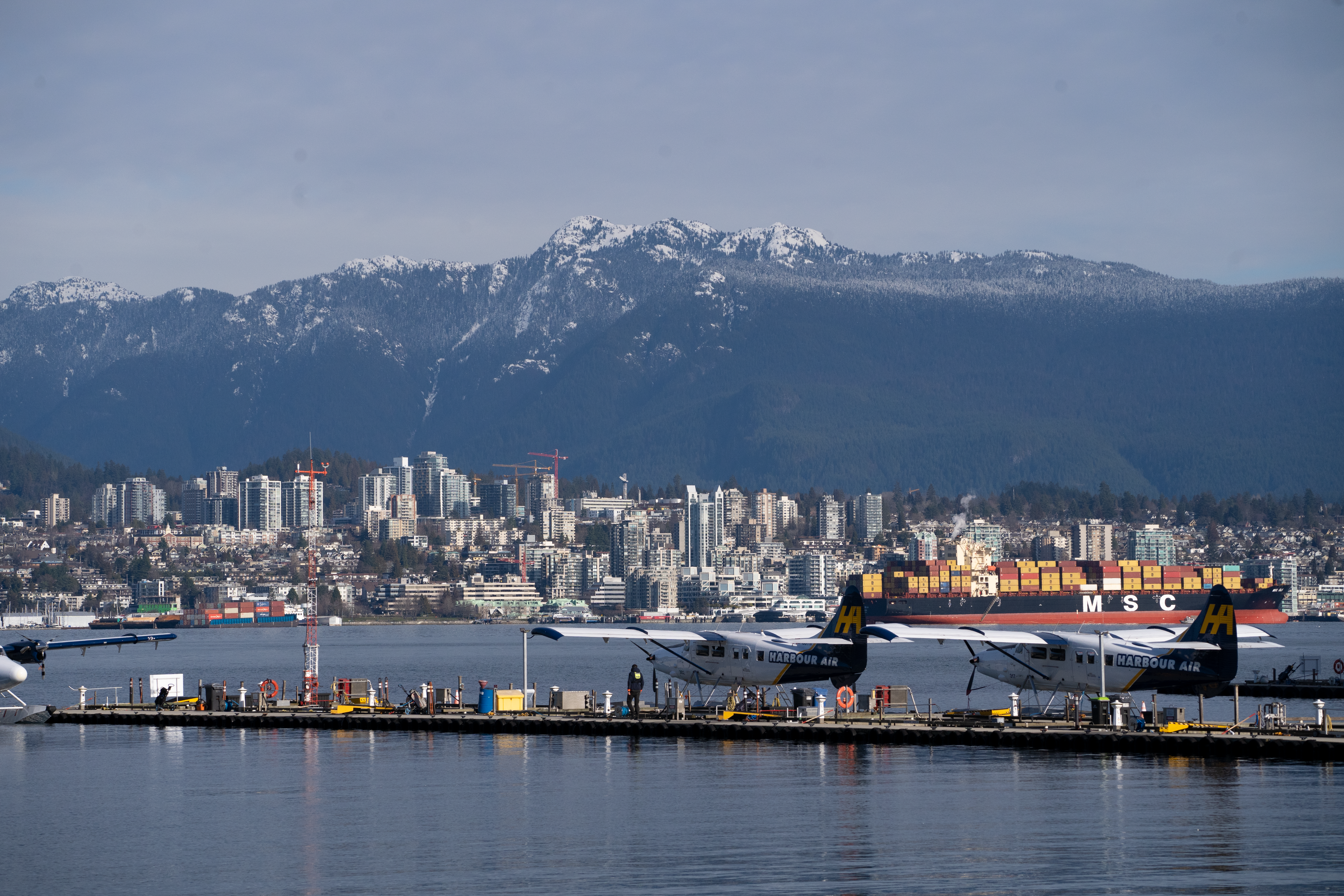 a large body of water with a city in the background