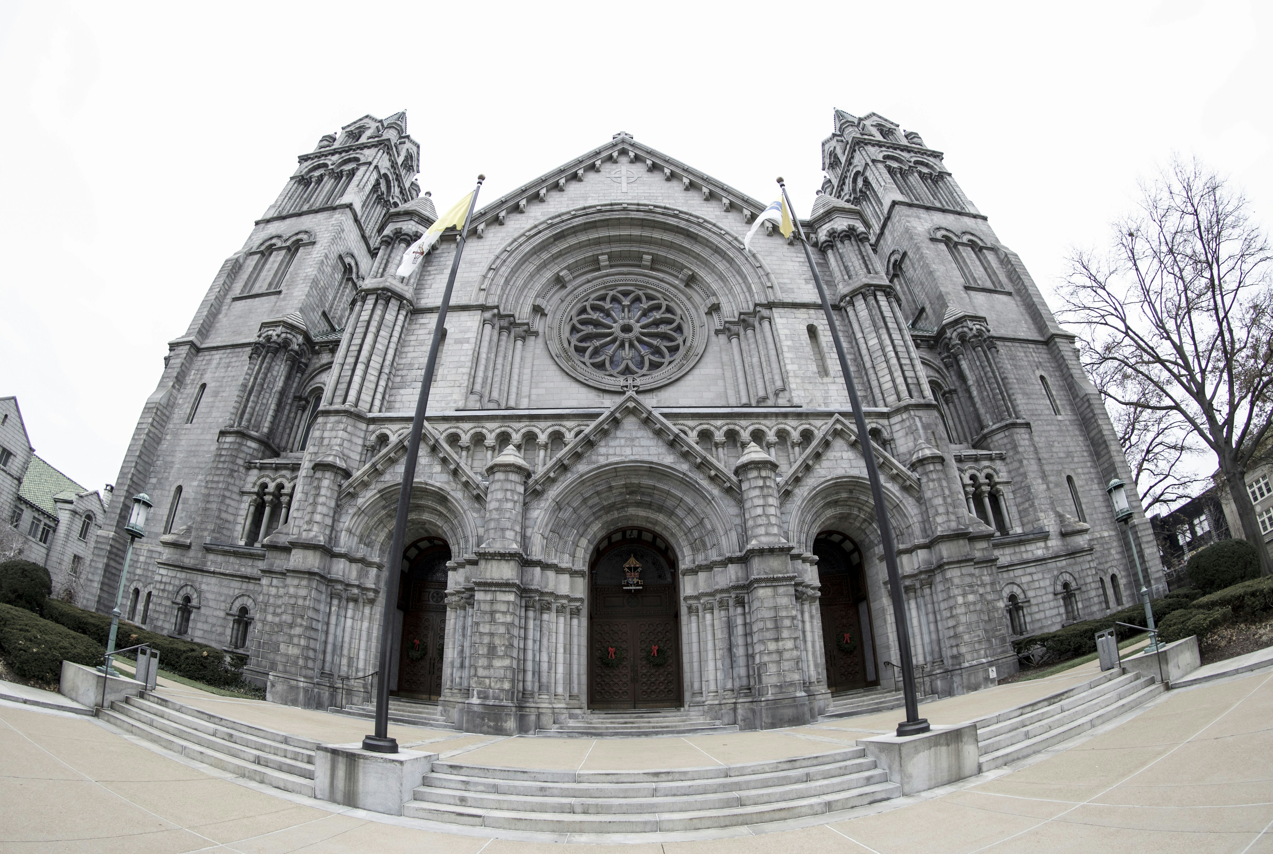 A large cathedral with a clock on the front of it