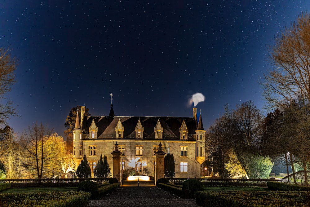 a castle like building lit up at night