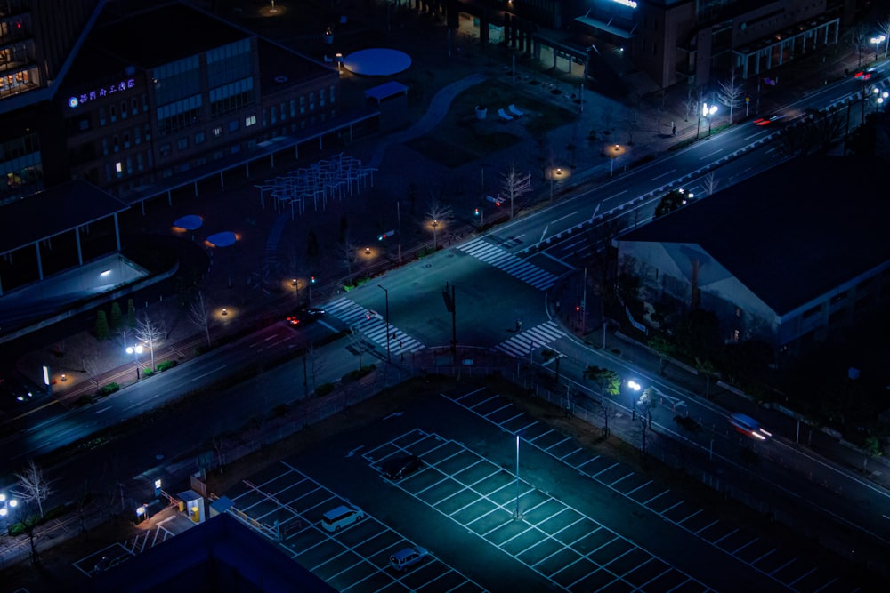 an aerial view of a tennis court at night