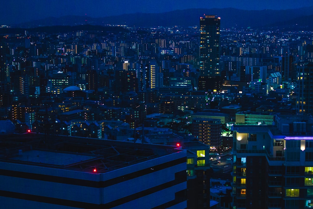 a view of a city at night from the top of a building