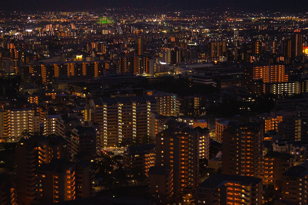 a view of a city at night from the top of a building