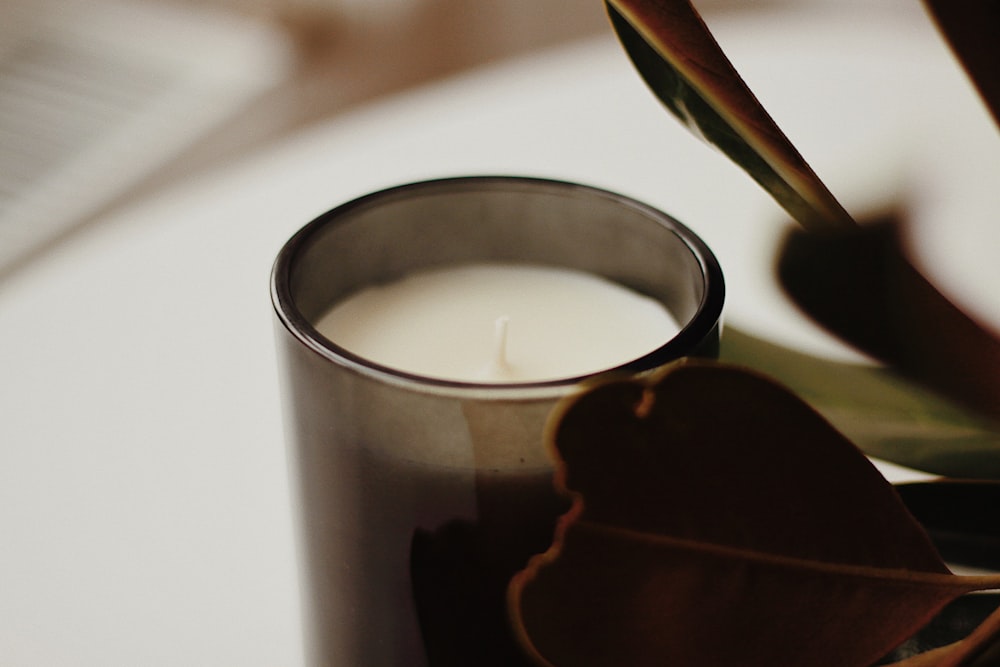 a close up of a candle on a table