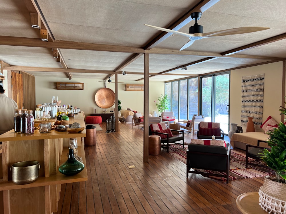 a living room filled with furniture and lots of windows