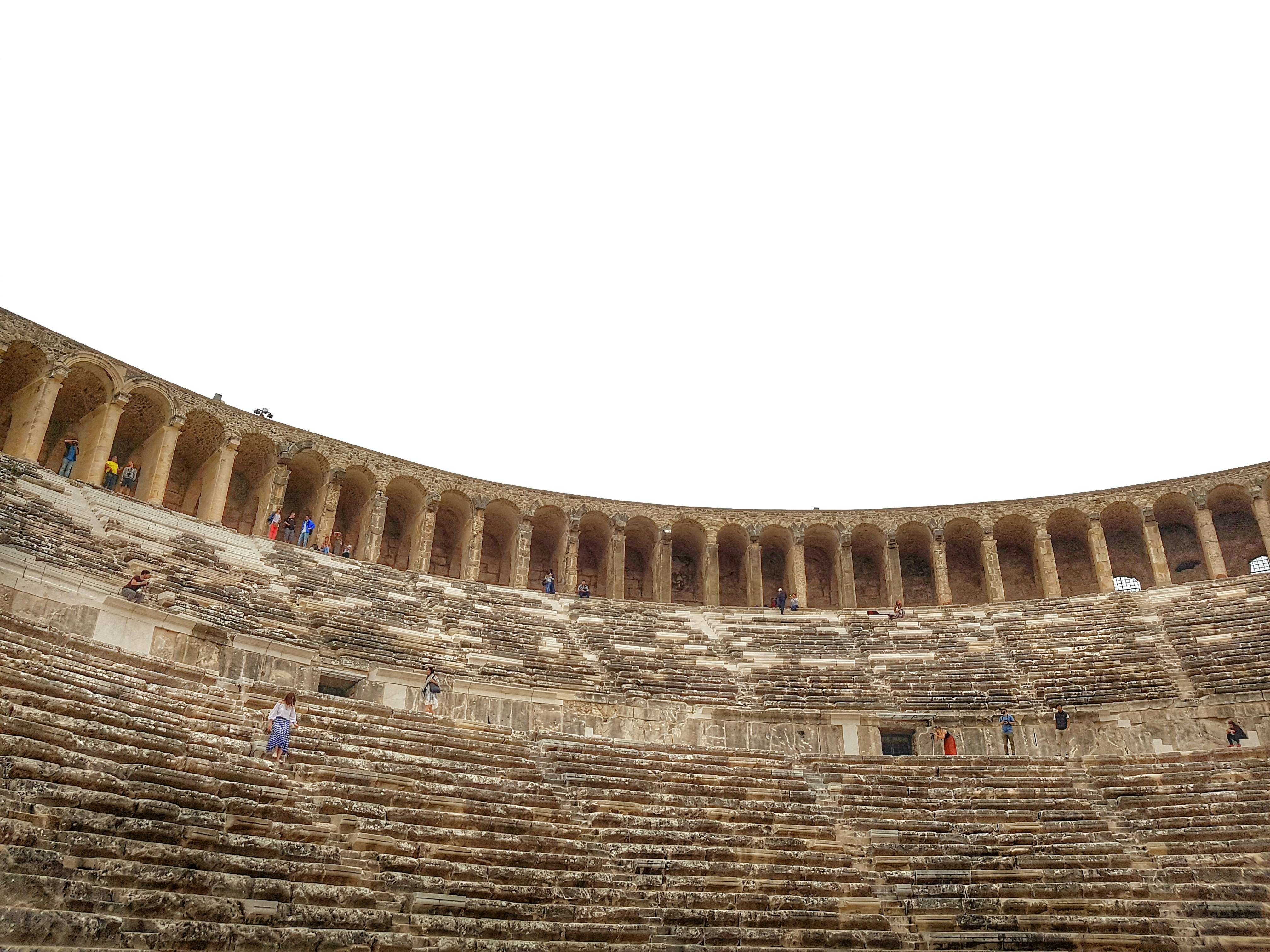 a group of people standing inside of a stone building