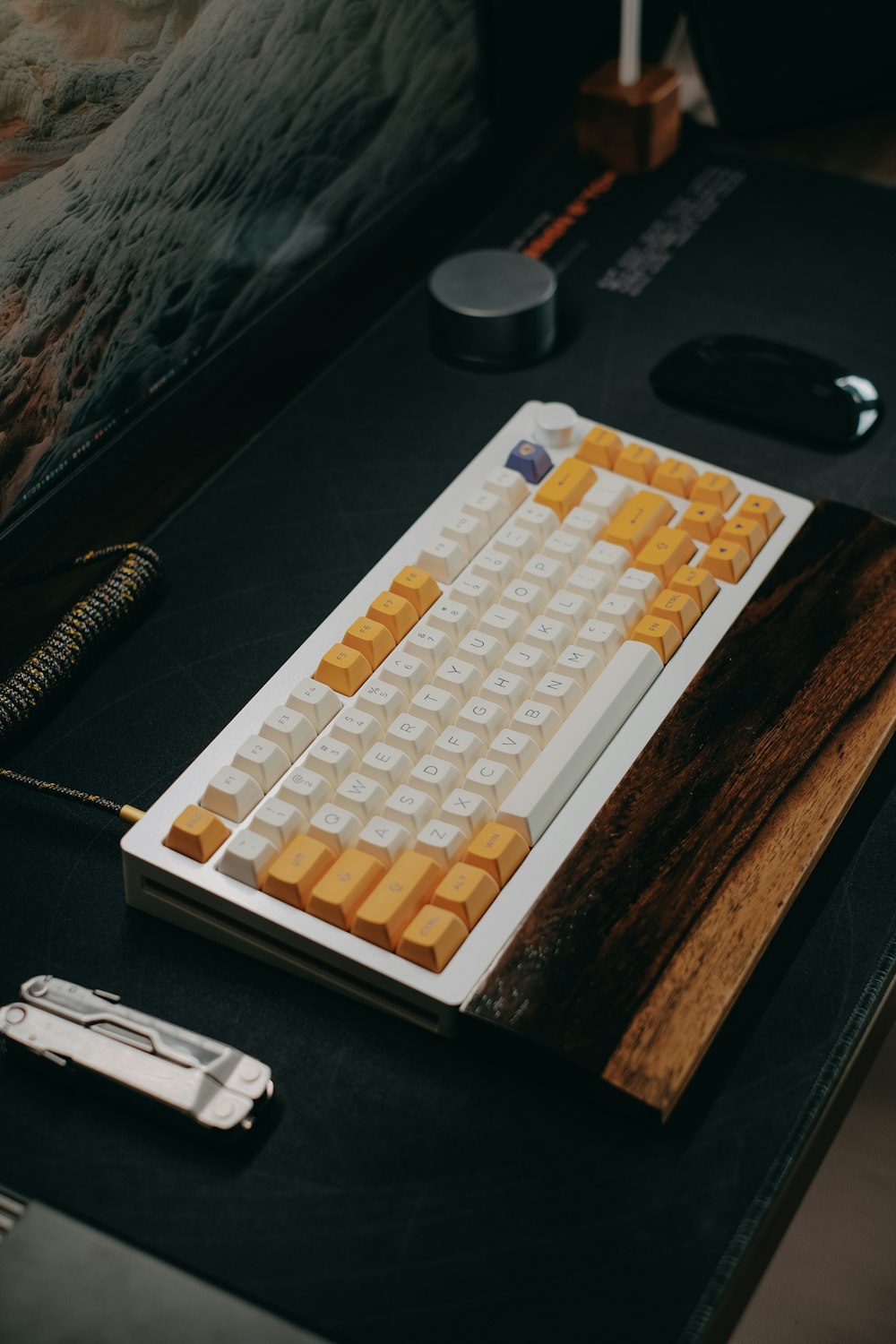 a keyboard sitting on top of a table next to a mouse