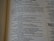 An open book with text on both visible pages, focusing on written content and paragraphs. The text includes religious or biblical references and verses can be identified.