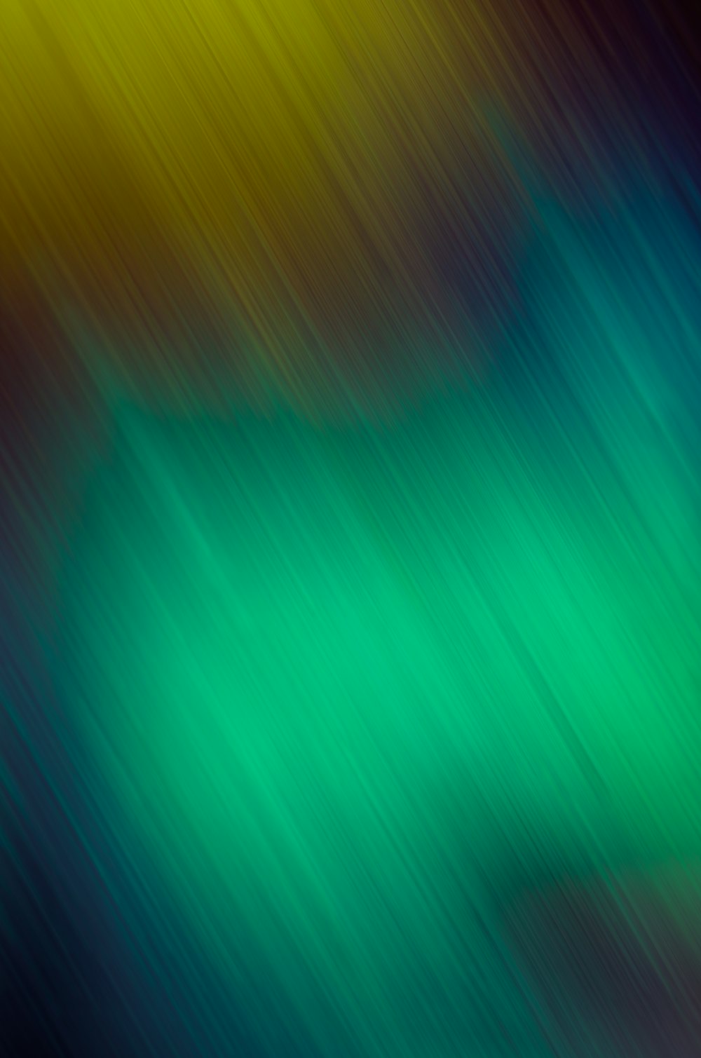 a blurry image of a green and yellow background