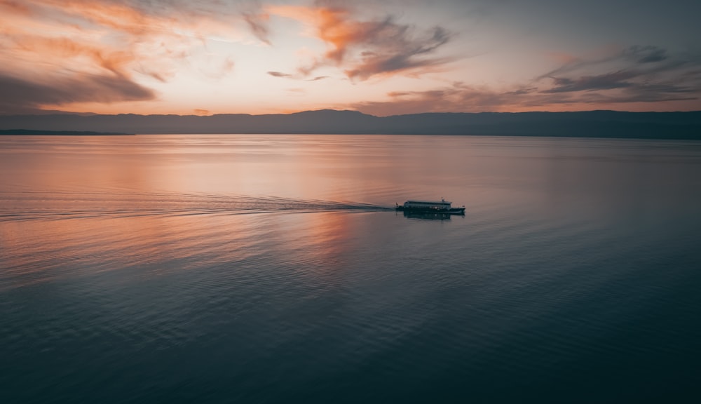 a boat traveling across a large body of water
