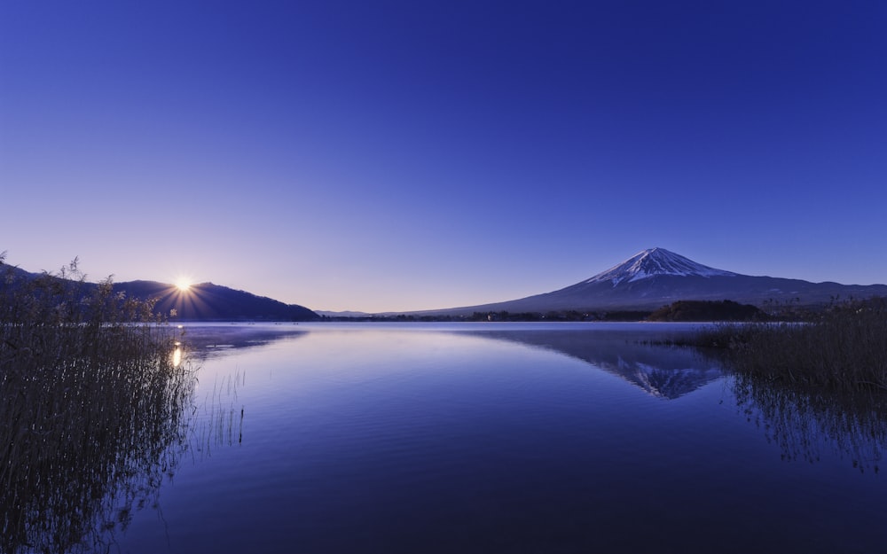 a lake with a mountain in the background