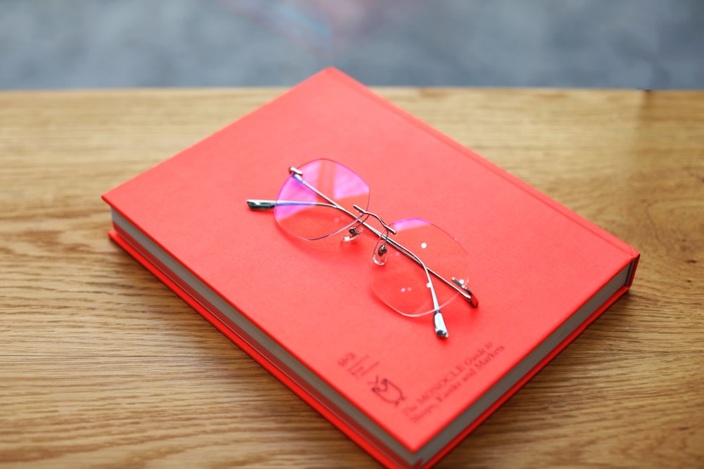 a book with a pair of glasses on top of it