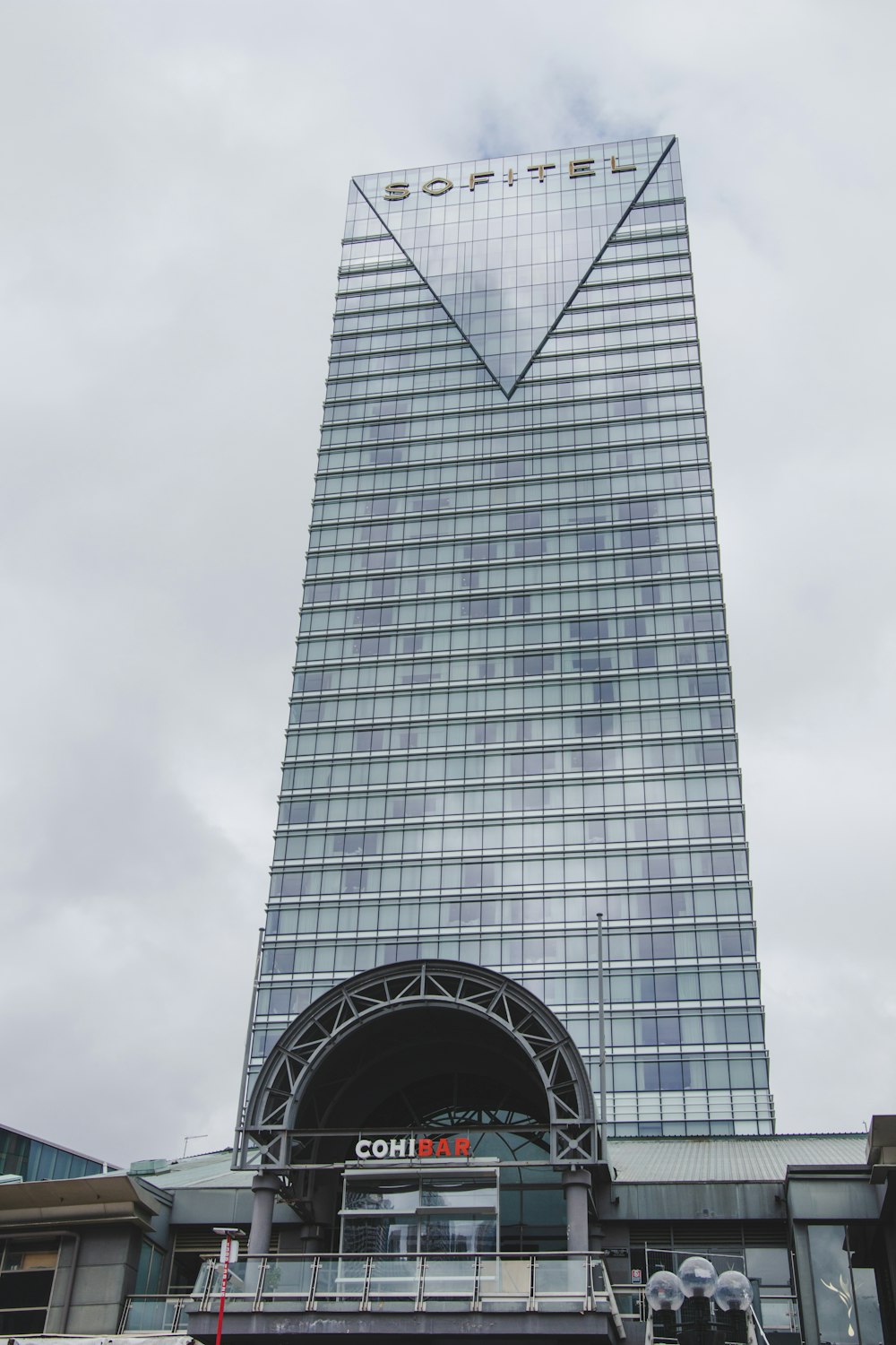 a very tall building with a very tall glass front