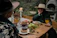 A happy couple enjoying a hearty Viking-style meal at a rustic wooden table.