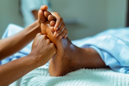 a person receiving a foot massage