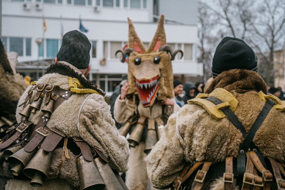 a group of people in costume walking down a street