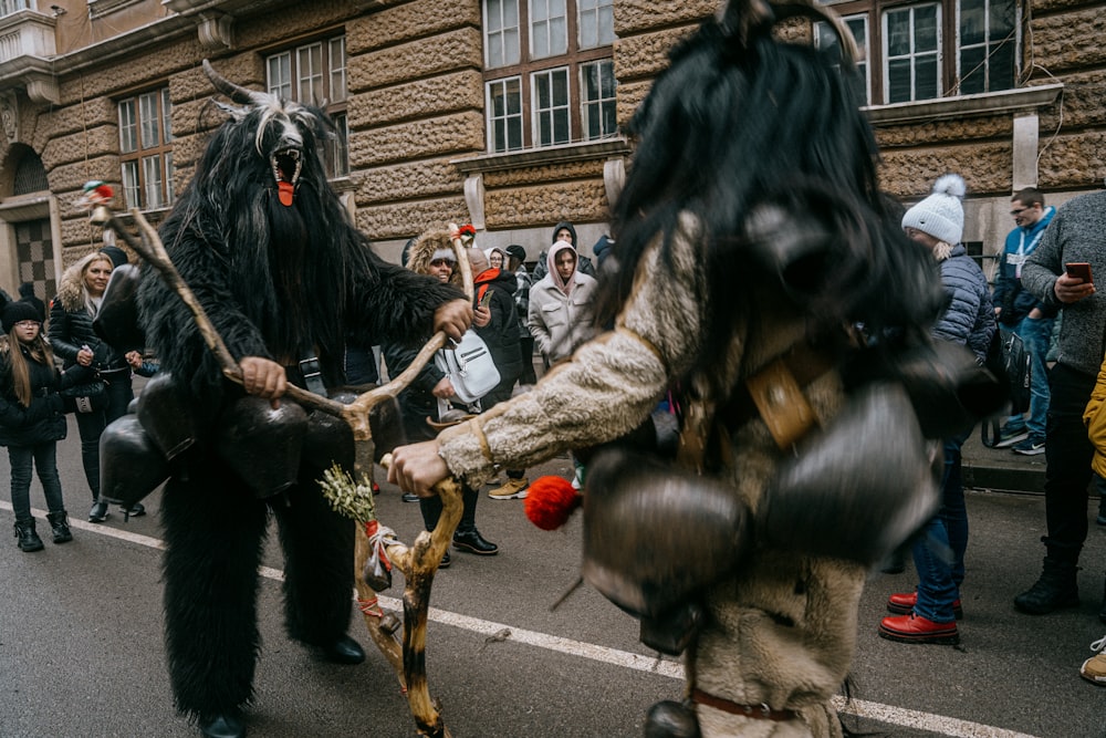 a group of people in costume walking down a street