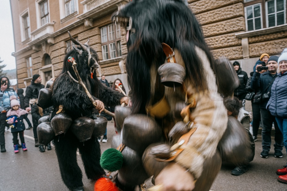 a group of people in costume walking down a street