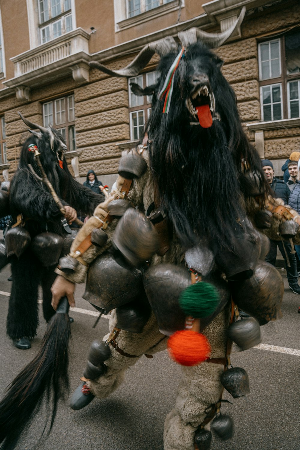 a group of people in costume walking down a street