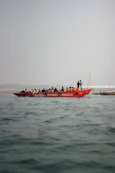 a group of people on a boat in the water