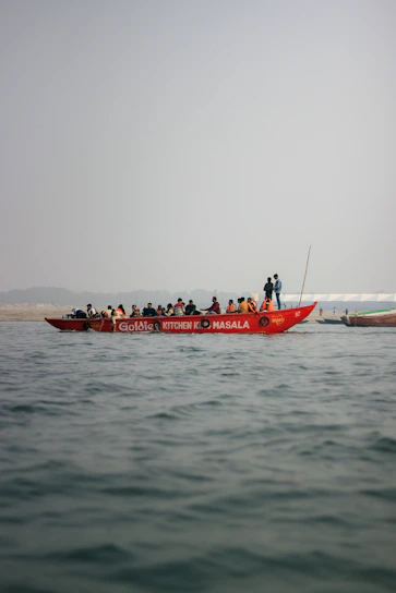 a group of people on a boat in the water
