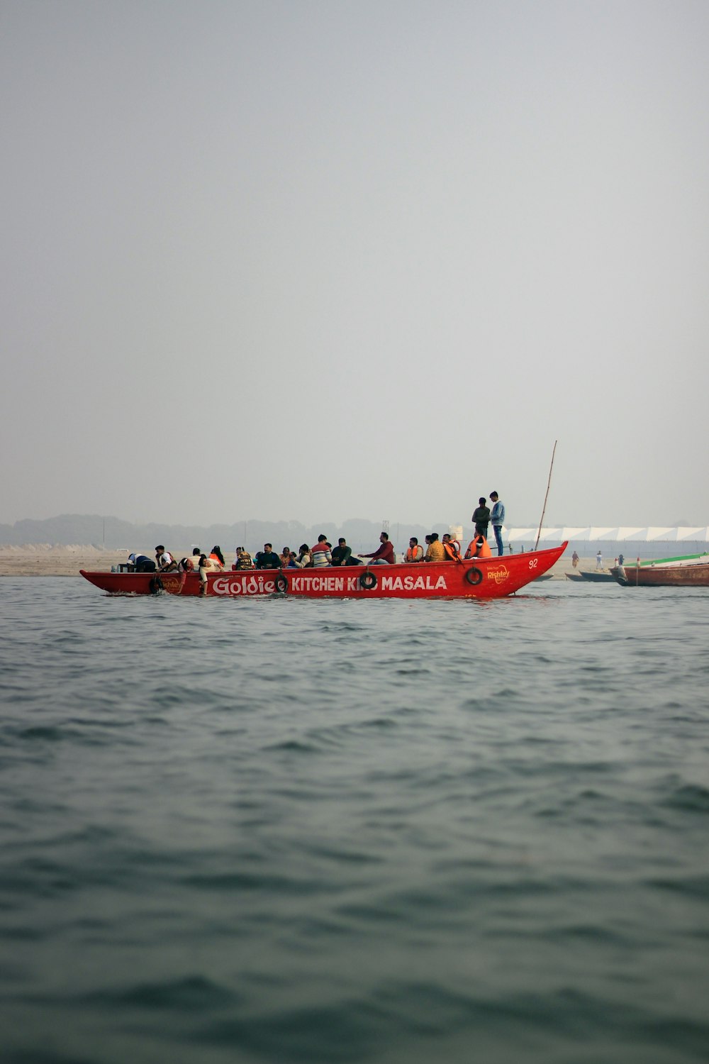 a group of people on a boat in the water