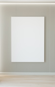 A bright living room wall freshly painted in crisp white with neat painter's tape still in place.