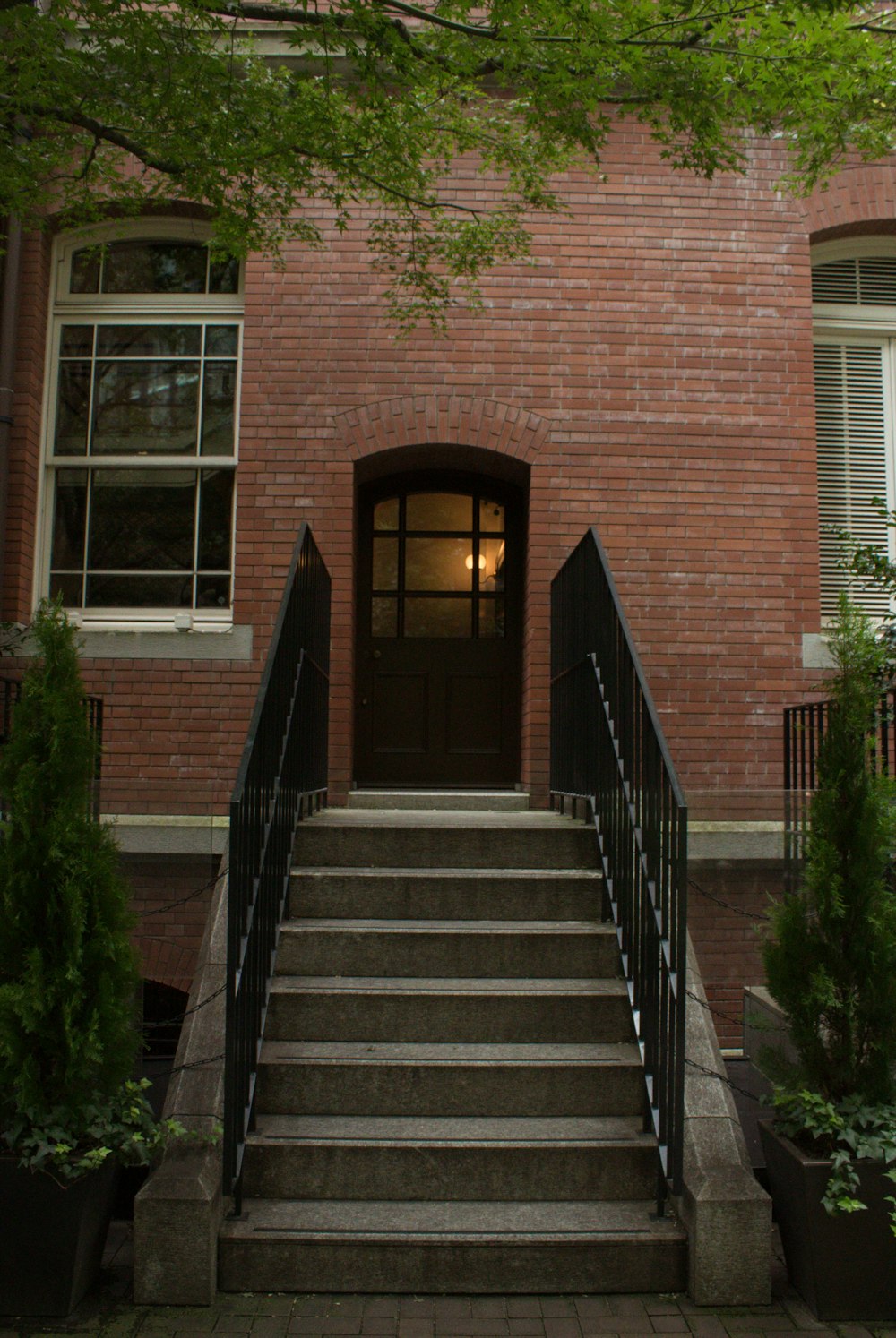 a set of stairs leading up to a brick building
