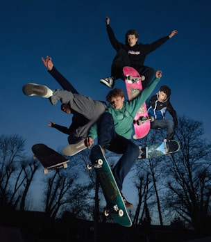 a group of skateboarders doing tricks in the air