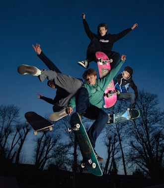 a group of skateboarders doing tricks in the air