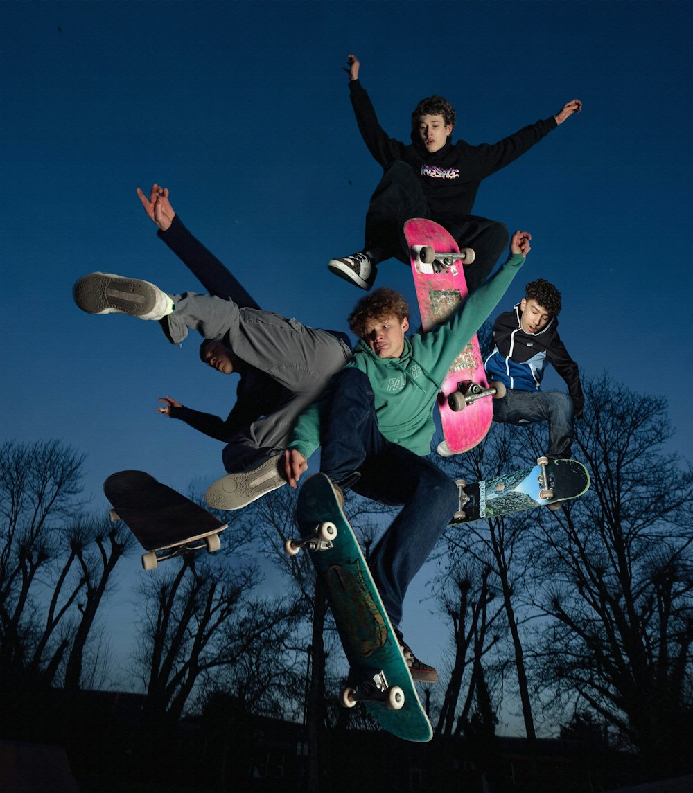 a group of skateboarders doing tricks in the air