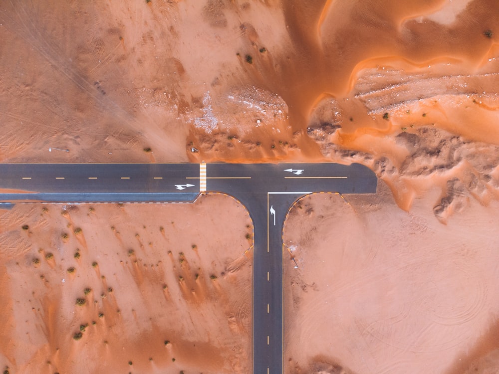 an aerial view of a road in the desert