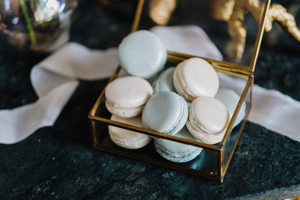 a box of macaroons sitting on a table