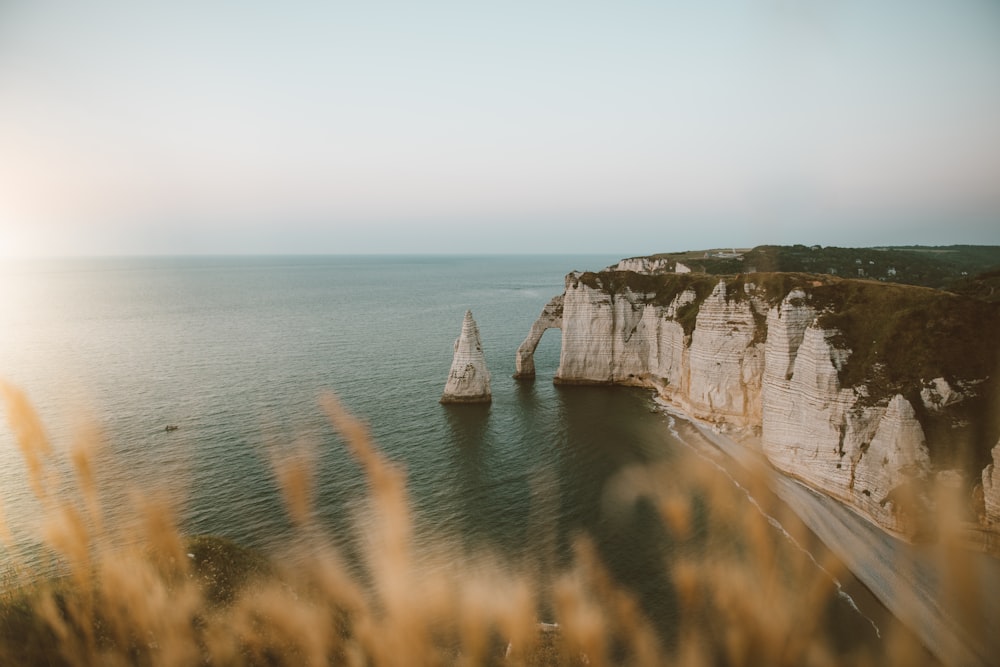 a large body of water next to a cliff