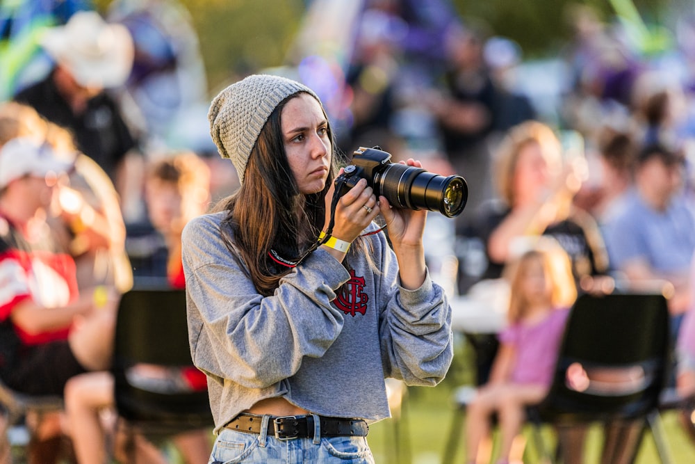 a woman taking a picture with a camera