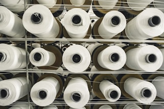 a rack of rolls of white paper in a store