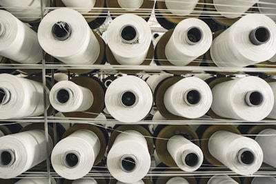 a rack of rolls of white paper in a store
