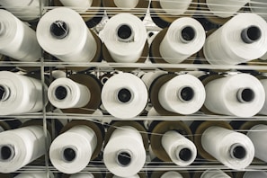 Close-up of tightly wound PP strap rolls stacked neatly in the factory.