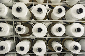 a rack of rolls of white paper in a store