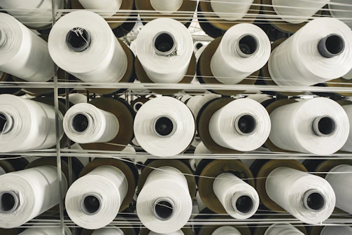 a rack of rolls of white paper in a store