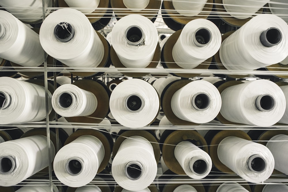 a rack of rolls of white paper in a store