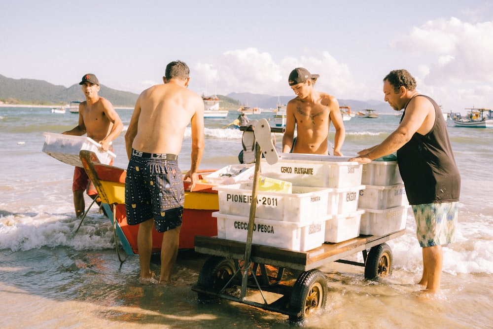 a group of men standing next to each other on a beach