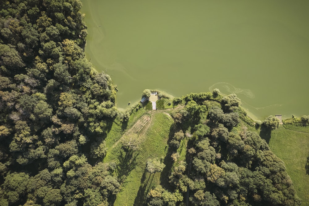 an aerial view of a house surrounded by trees