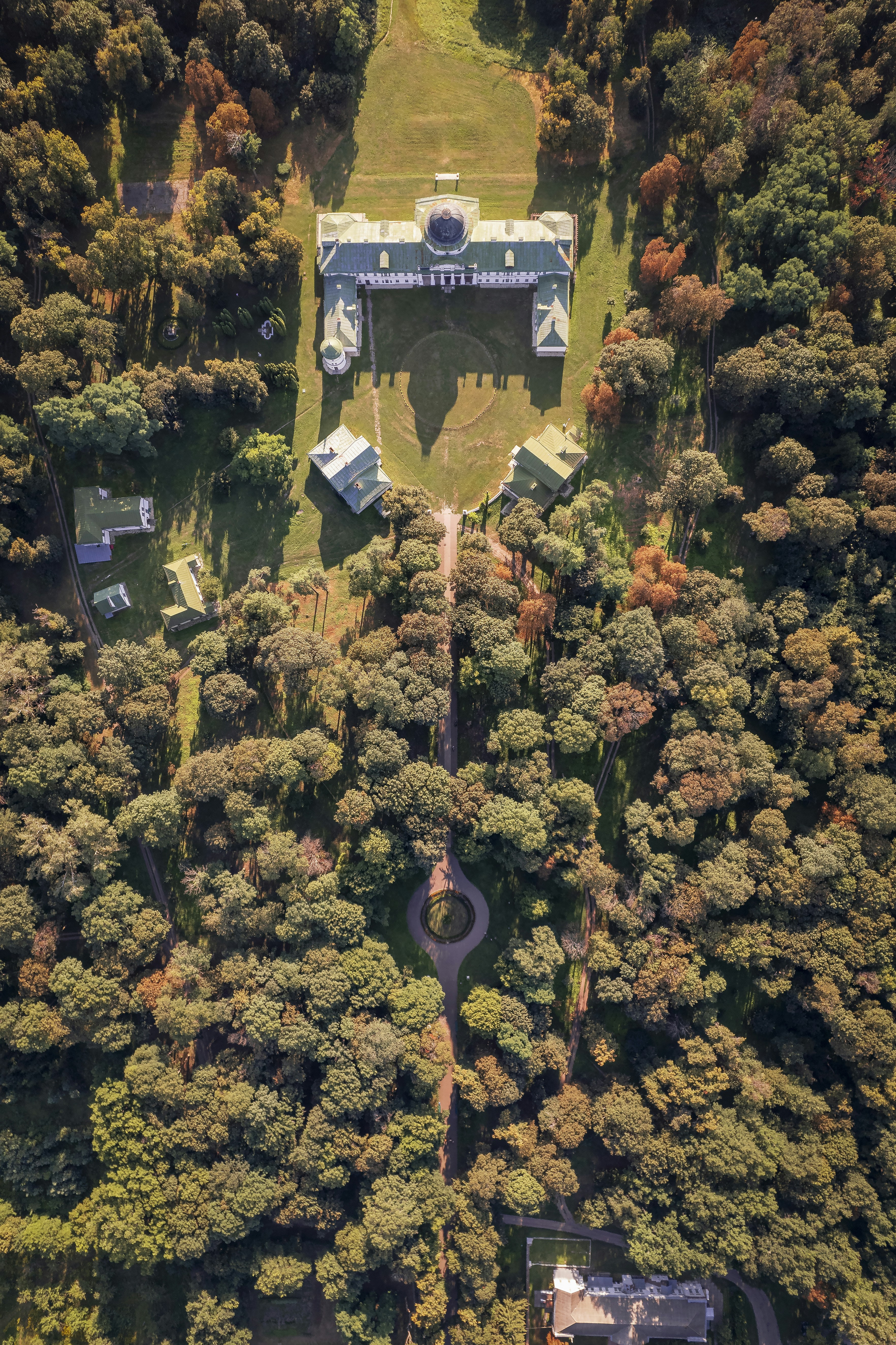 an aerial view of a house surrounded by trees